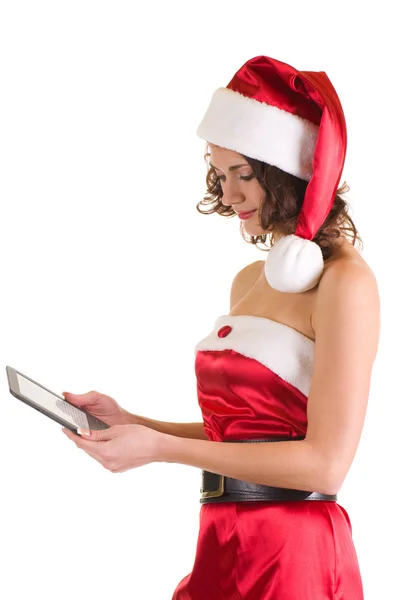 Menina em roupas de Papai Noel com notebook — Fotografia de Stock
