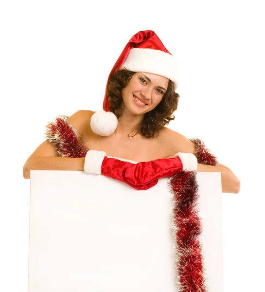 Mujer con ropa de Santa Claus apoyada en tablero en blanco —  Fotos de Stock