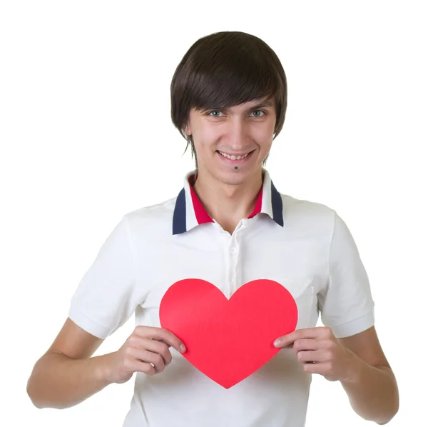 Молодой человек с красным сердцем — стоковое фото