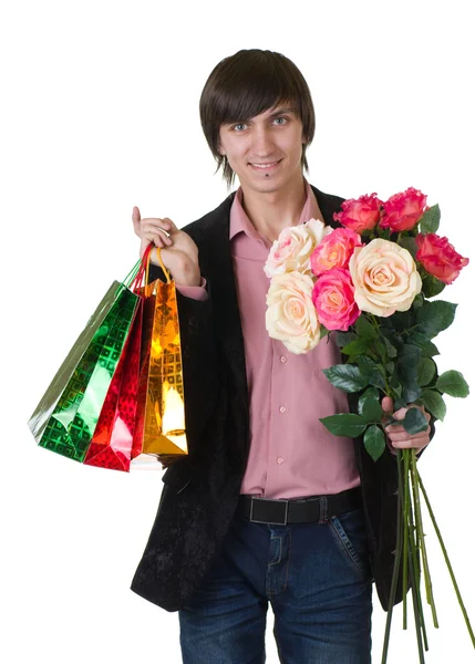 San Valentín Hombre con flores y bolsas de compras —  Fotos de Stock