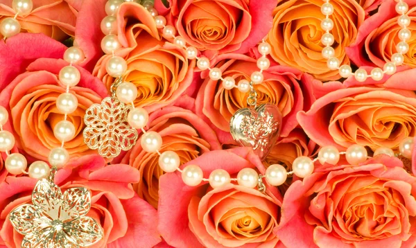 Beautiful background of rose and beads — Stock Photo, Image
