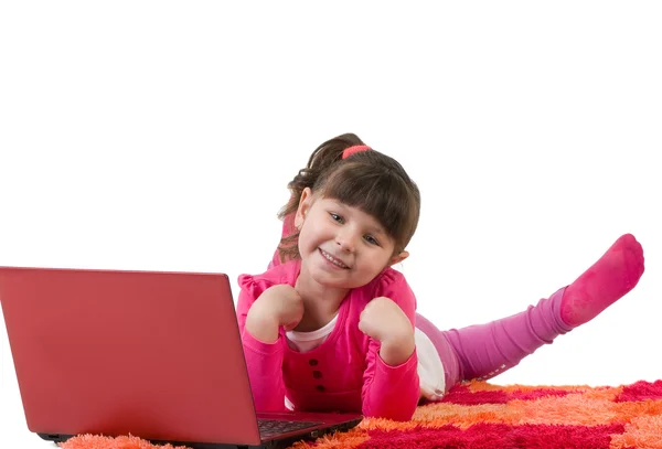 Cute little girl with laptop isolated over white — Stock Photo, Image