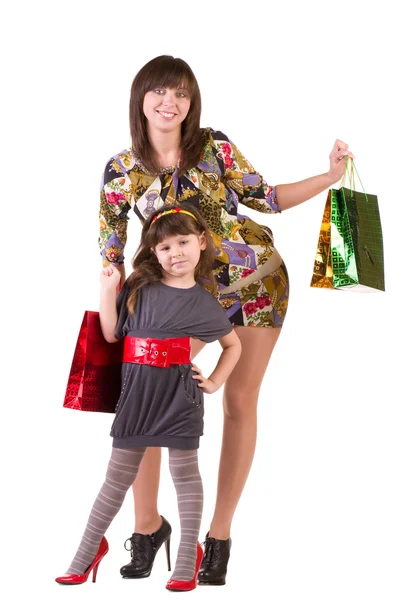 Happy mother and little girl with shopping bags — Stock Photo, Image