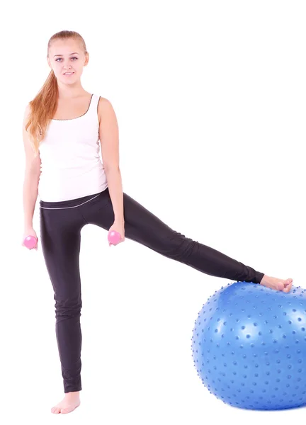 Young woman in gym with a blue ball — Stock Photo, Image