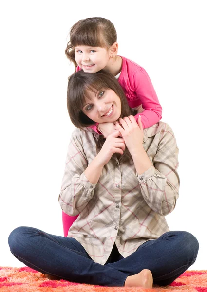 Mother and her little daughter embracing — Stock Photo, Image