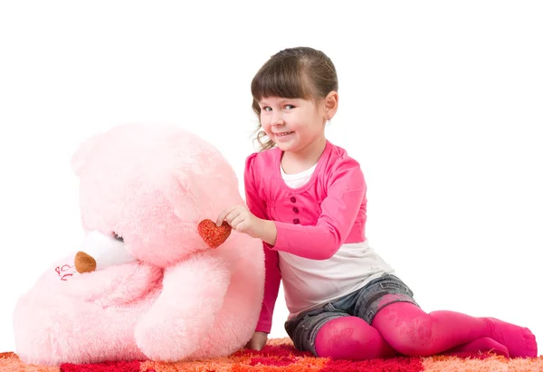 Cute little girl with pink bear on white background — Stock Photo, Image