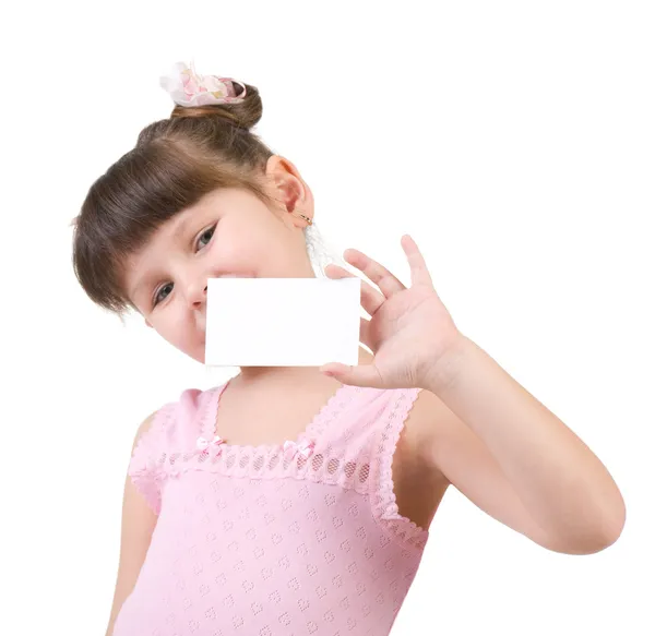 Smiling little girl holding empty white board — Stock Photo, Image