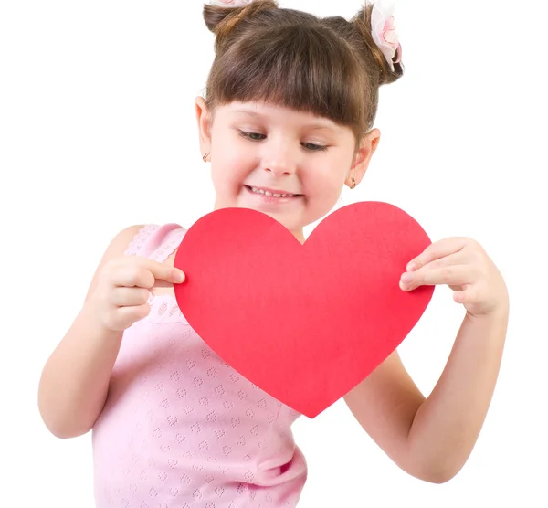 Happy little girl with red heart isolated on white — Stock Photo, Image