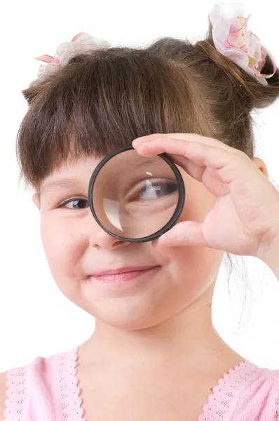 Little girl with magnifying glass isolated on white — Stock Photo, Image