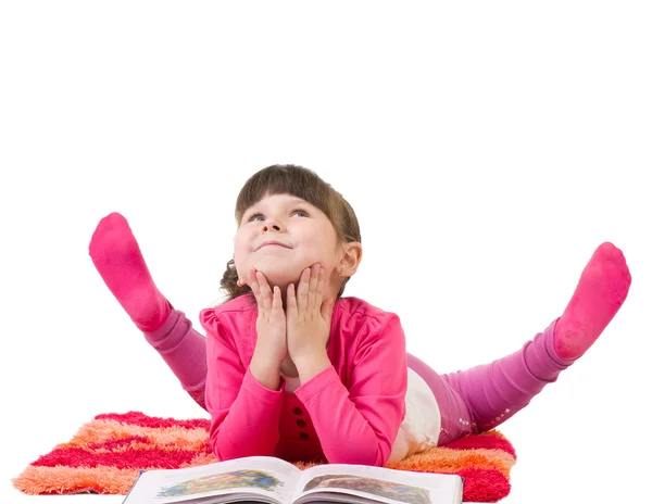 Happy little girl reading book — Stock Photo, Image