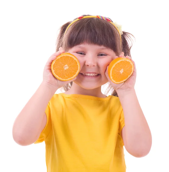 Beautiful little girl with orange — Stock Photo, Image