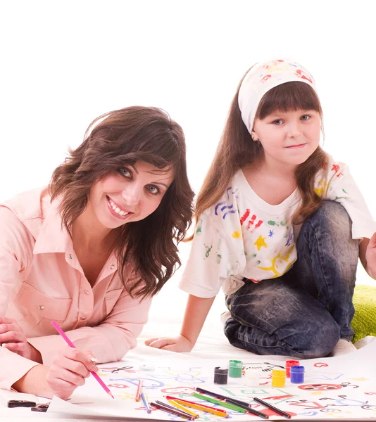 Madre y su hija pequeña con pintura de color — Foto de Stock