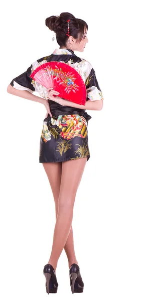 Žena v asijské kostým s červeným asijské ventilátor — Stock fotografie