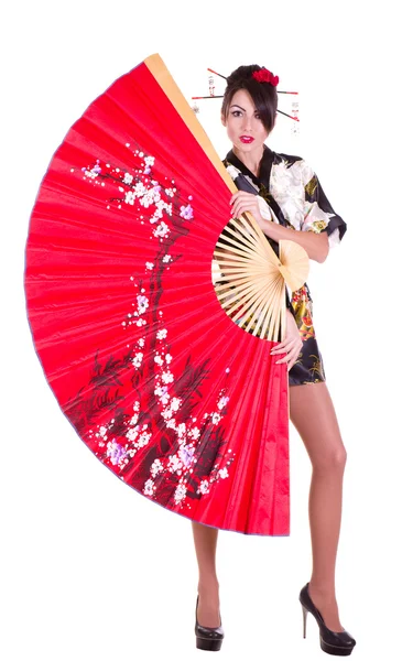 Frau im asiatischen Kostüm mit rotem asiatischen Fächer — Stockfoto