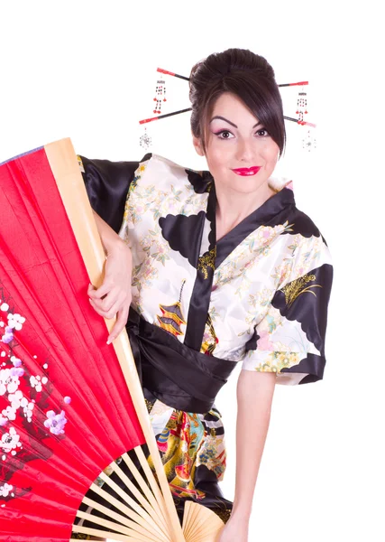 Mujer en traje asiático con rojo ventilador asiático — Foto de Stock