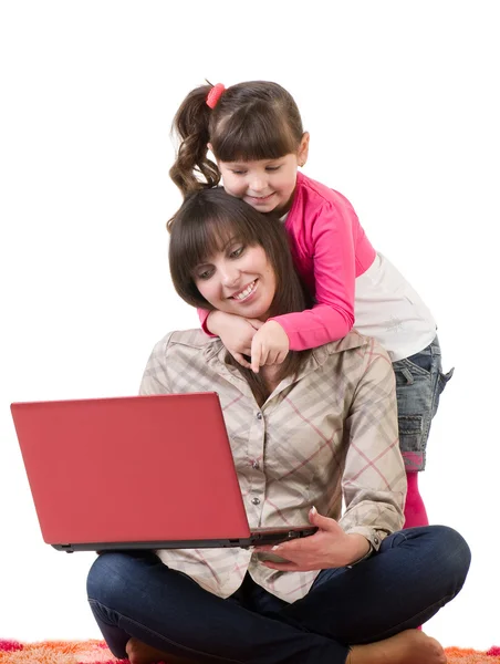 Mother and her little daughter with laptop — Stock Photo, Image