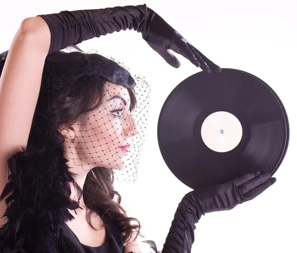 Femme dans le style rétro avec plaque de vinyle — Photo