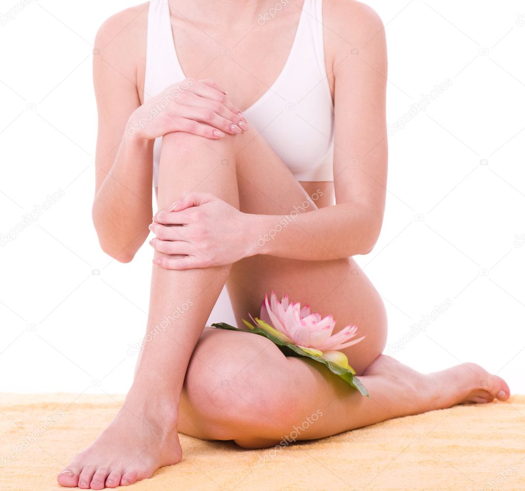 Woman body in white underwear with pink lily
