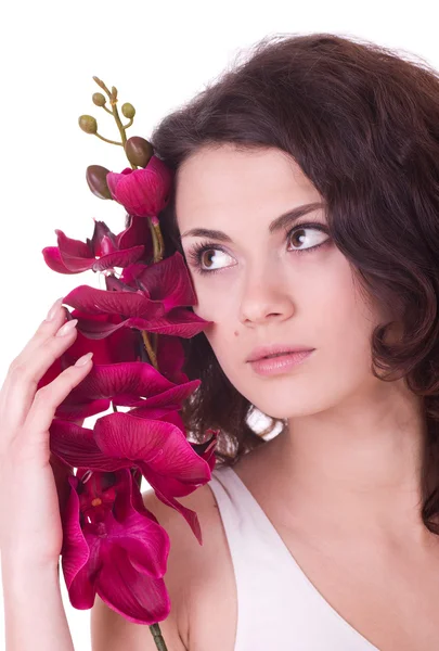 Beauty face of the young woman with flower — Stock Photo, Image