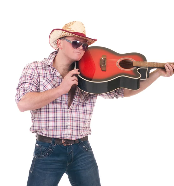 Hezký muž s kovbojský klobouk s kytarou — Stock fotografie