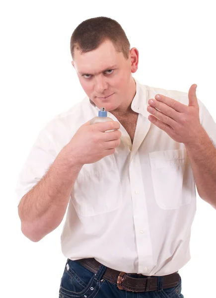 Parfüm şişesi ile genç adam — Stok fotoğraf