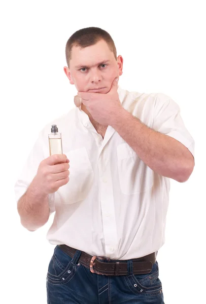 Young man with perfume bottle — Stock Photo, Image