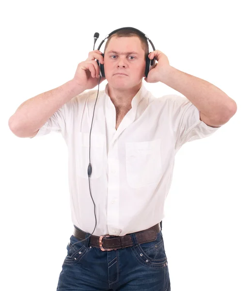 Jovem ouvindo música no fone de ouvido — Fotografia de Stock