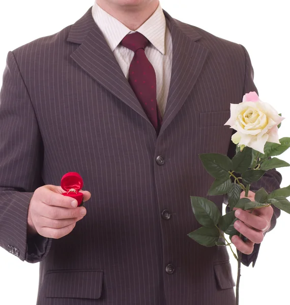 Muž s květinami a dárky — Stock fotografie