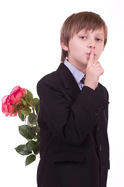Little beautiful boy with pink roses — Stock Photo, Image