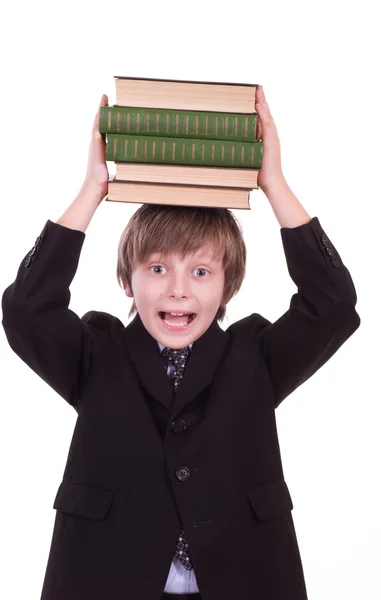 Liten skolpojke med böcker — Stockfoto