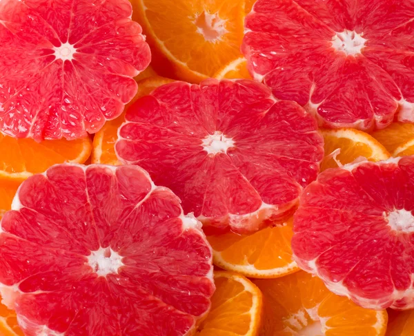 与葡萄柚和橙色背景 — 图库照片