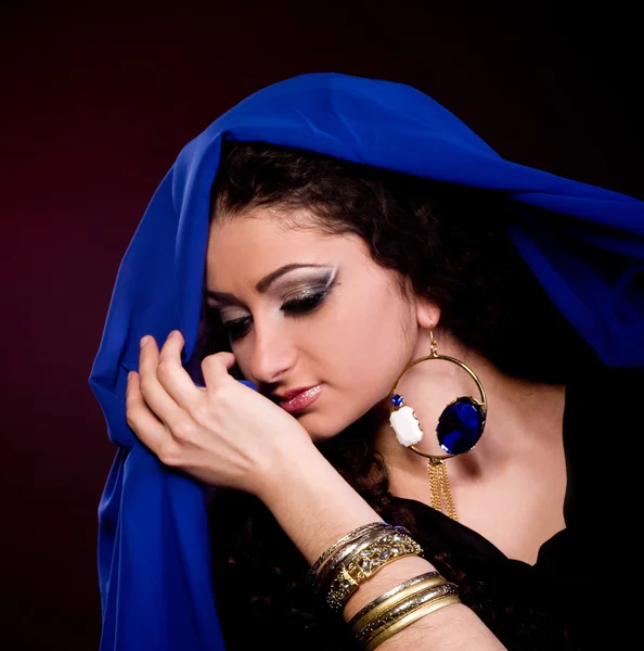 Beautiful young woman in color arabian clothes — Stock Photo, Image