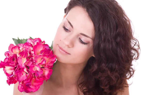 Gezicht van de jonge vrouw met bloem — Stockfoto