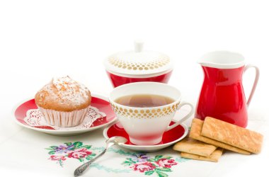 Beautiful tea set with cupcakes clipart