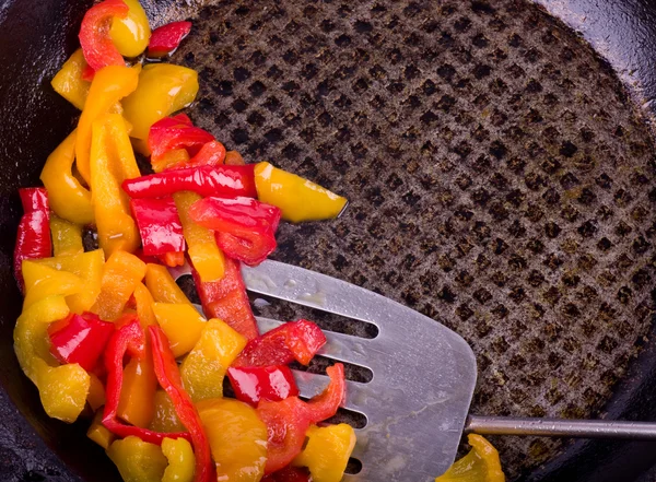 Tasty color peppers in frying pan — Stock Photo, Image