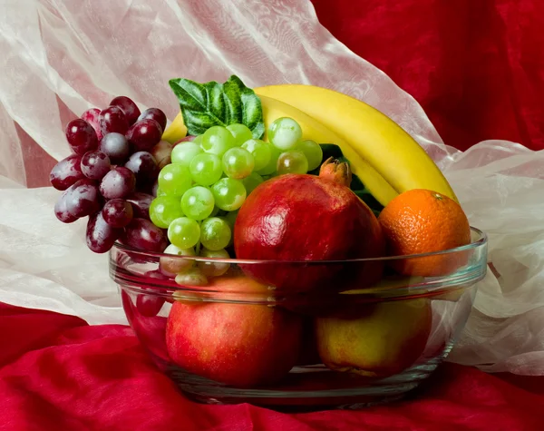 Beautiful composition with fruits on vase — Stock Photo, Image