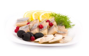 Testy cut herring with vegetable on the plate clipart