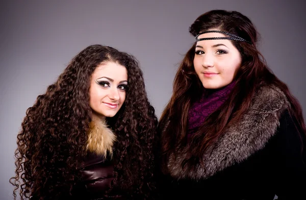 The beautiful girls in a fur coat — Stock Photo, Image