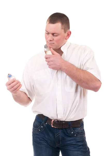 Homem bonito com frasco de perfume — Fotografia de Stock