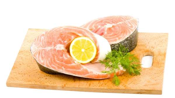 Trozo de salmón con limón y eneldo — Foto de Stock