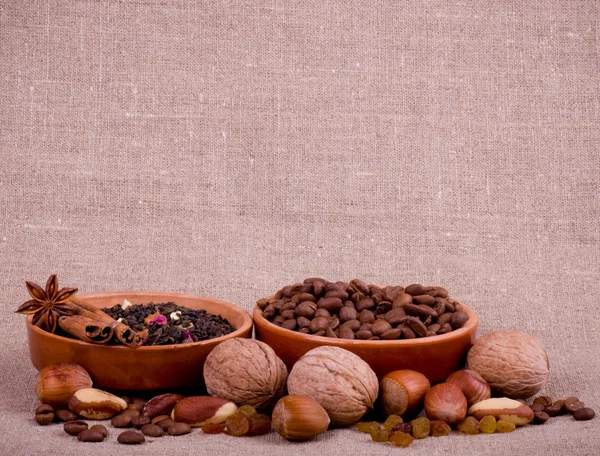 Nuts, raisin, cinnamon, tea and coffee — Stock Photo, Image