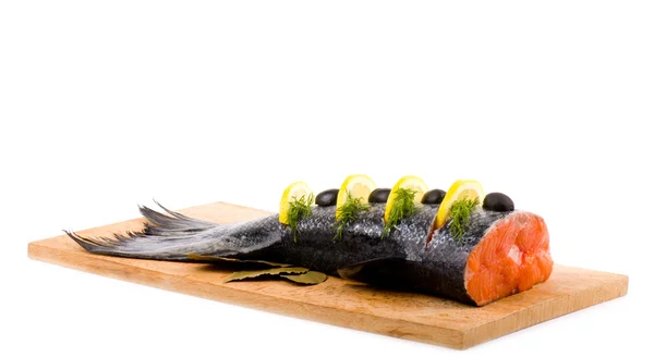 Piece of a salmon with lemon and olives — Stock Photo, Image