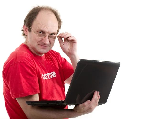 Starší muž s notebookem — Stock fotografie