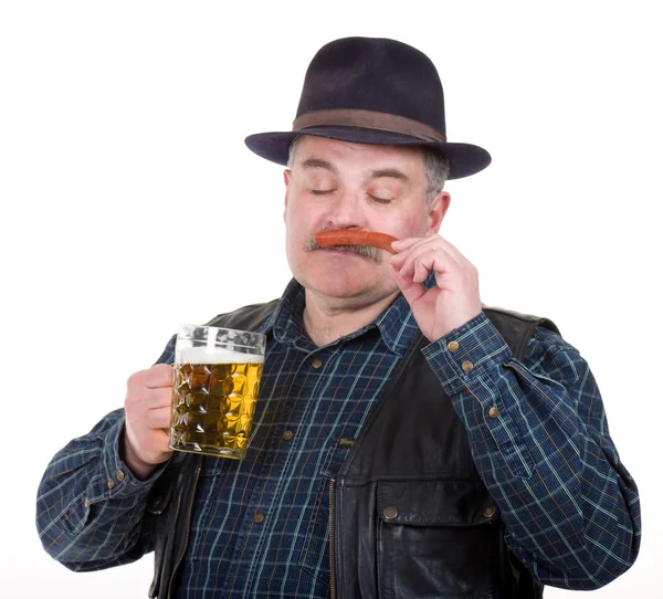 Elderly man holding a beer belly and sausage — Stock Photo, Image