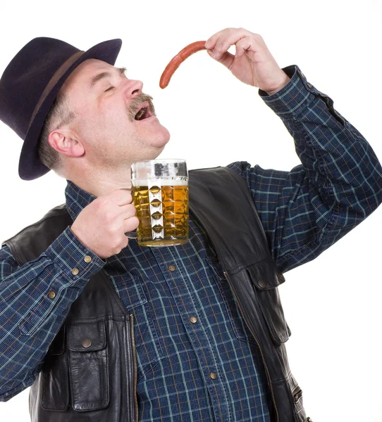 Elderly man holding a beer belly and sausage — Stock Photo, Image