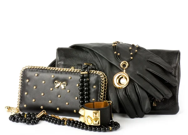 Sexy fashionable handbag and golden jewelry on white background. — Stock Photo, Image
