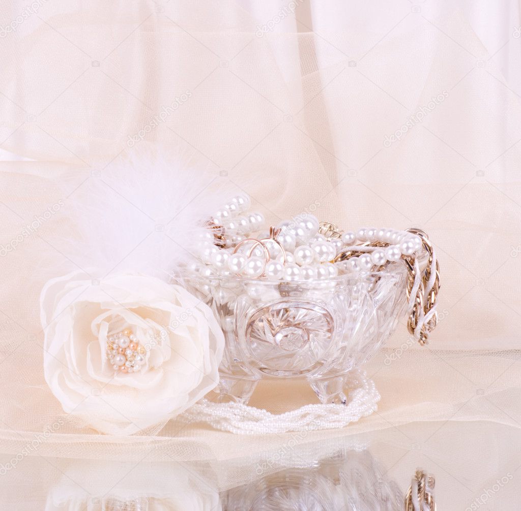 The beautiful bridal rose with wedding beads in crystal vase