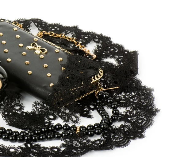 Sexy fashionable handbag and beads on white background. — Stock Photo, Image