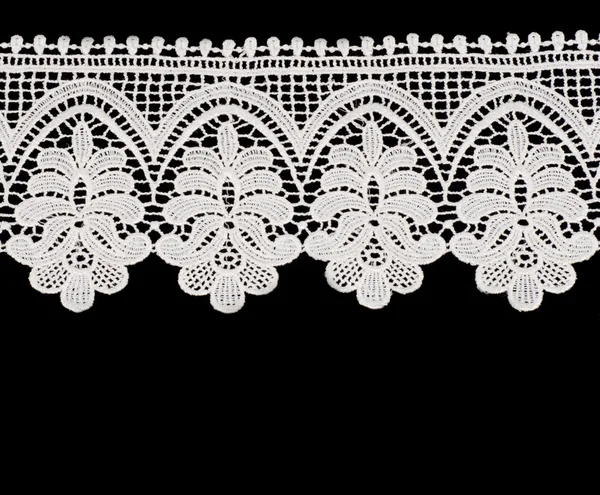 White floral lace on a black background. — Stock Photo, Image