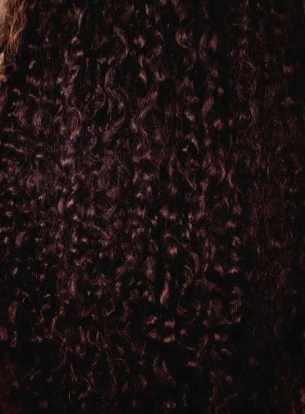 Faliste brązowe włosy jako tło — Zdjęcie stockowe